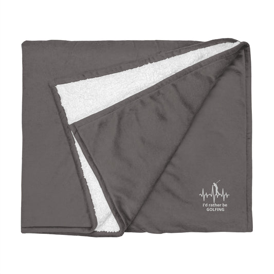 Gray blanket with white fleece lining and 'I'd rather be golfing" branding on a white background