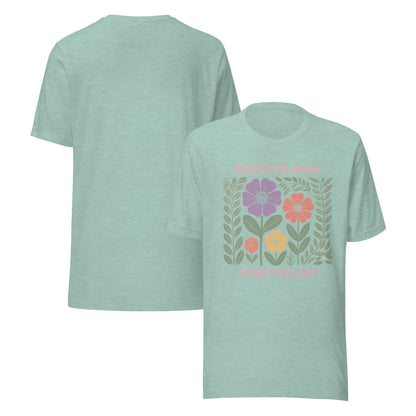 Light green t-shirt with floral design and text on a white background