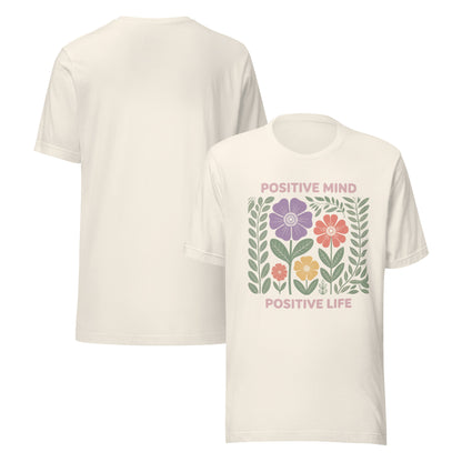 White t-shirt with floral design and 'Positive Mind Positive Life' text on a white background