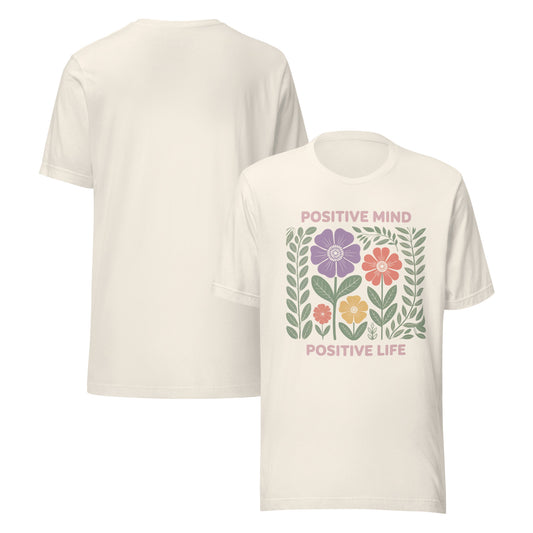 White t-shirt with floral design and 'Positive Mind Positive Life' text on a white background
