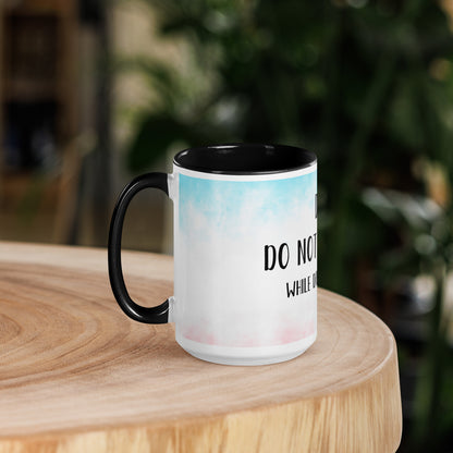 coffee Mug with humorous text on a wooden surface with a blurred background